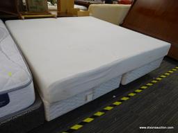 CAL KING FOAM MATTRESS WITH SPLIT BOX SPRING AND METAL BED FRAME.