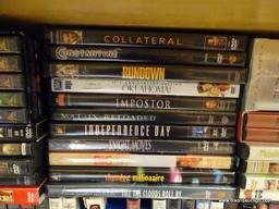 (R2) SHELF LOT OF DVDS; LOT INCLUDES 5 VOLUMES OF STARGATE SG-1, SKYFALL, TITANIC, BLADE RUNNER,