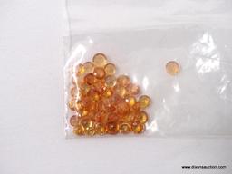 PARCEL BAG WITH 10CT OF MIXED, ROUND SPESSARTITE GARNETS. ROUGHLY 42 PIECES.