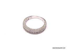DIAMOND CHANNEL SET ETERNITY BAND. TOP 3/4 OF THE RING IS SET WITH 20 DIAMONDS. DESINGER SIGNED,