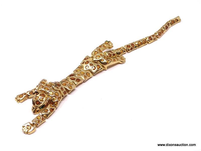 VINTAGE ARTICULATED LEOPARD SHOULDER DRAPE BROOCH/PIN . FEATURES A RICH GOLD TONE BODY, WITH