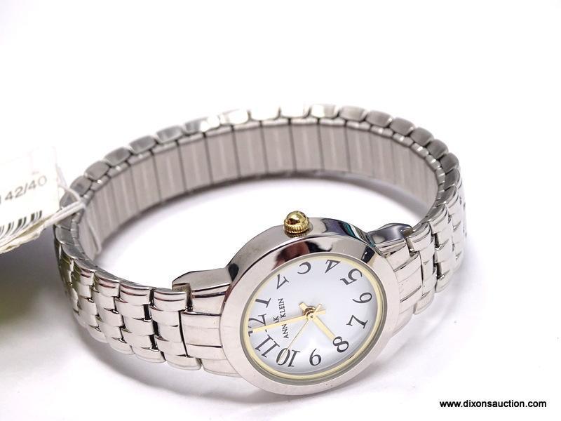 ANNE KLEIN LADIES' QUARTZ STAINLESS STEEL WRIST WATCH. NEW, WITH TAG. DIAL FEATURES LARGE, EASY TO