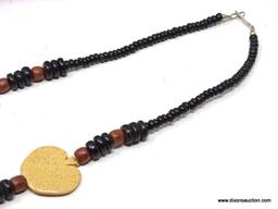 VINTAGE ARTISAN CRAFTED CHUNKY WOOD BEAD AND WOOD CHIP NECKLACE. FEATURES A FRONT 6" FOCAL OF DARK