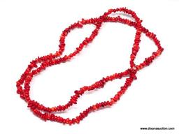 36" TUMBLED AND POLISHED CORAL BEAD NECKLACE. IN VARYING WIDTHS, THE LONGEST ABOUT 1/4". HAND STRUNG