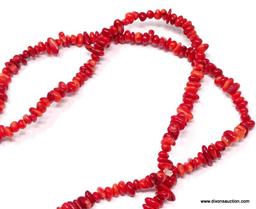 36" TUMBLED AND POLISHED CORAL BEAD NECKLACE. IN VARYING WIDTHS, THE LONGEST ABOUT 1/4". HAND STRUNG
