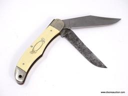 SCHRADE SCRIMSHAW FOLDING HUNTER IS A 5 1/4" CLOSED KNIFE WITH A HEAVY DUTY BONING AND CLIP BLADE