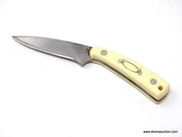 SCHRADE SCRIMSHAW DROP POINT IS A 7 1/4" RIGID BLADE TRAIL KNIFE WITH A 3 1/2" HIGH CARBON CUTLERY