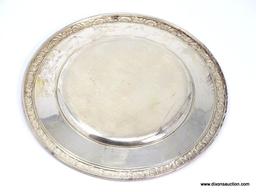 INTERNATIONAL STERLING PRELUDE PATTERN SAUCER WITH FLORAL EMBOSSED RIM. ENGRAVED WRITING IN THE