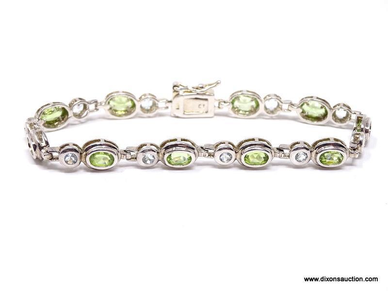 DAZZLING STERLING SILVER AND GEMSTONE BEZEL SET BRACELET. FEATURES A BOLD BOX CLASP WITH SAFETY SNAP