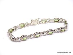 DAZZLING STERLING SILVER AND GEMSTONE BEZEL SET BRACELET. FEATURES A BOLD BOX CLASP WITH SAFETY SNAP