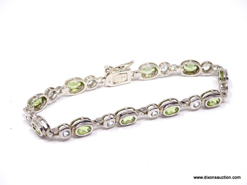 DAZZLING STERLING SILVER AND GEMSTONE BEZEL SET BRACELET. FEATURES A BOLD BOX CLASP WITH SAFETY SNAP