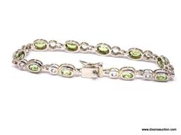 DAZZLING STERLING SILVER AND GEMSTONE BEZEL SET BRACELET. FEATURES A BOLD BOX CLASP WITH SAFETY SNAP