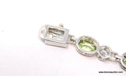 DAZZLING STERLING SILVER AND GEMSTONE BEZEL SET BRACELET. FEATURES A BOLD BOX CLASP WITH SAFETY SNAP