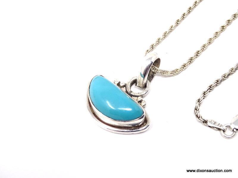 NATIVE AMERICAN HAND CRAFTED STERLING SILVER AND SLEEPING BEAUTY TURQUOISE HALF MOON PENDANT.