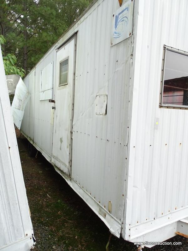 WHITE CONTRACTOR OFFICE TRAILER. RUSTED. PLEASE PREVIEW FOR CONDITION. COME PREPARED TO MOVE IT.