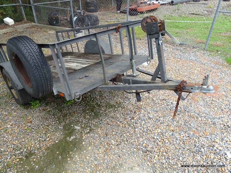 10' X 5' BLACK PULL BEHIND UTILITY TRAILER WITH RAMP. COMES WITH WINCH AND SPARE TIRE. MEASURES 15'
