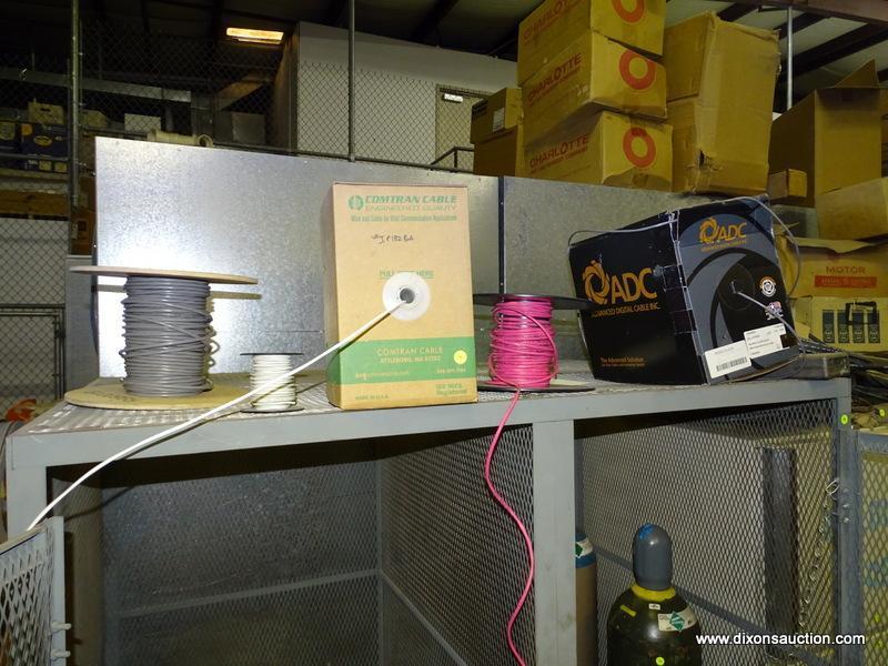 (5) SPOOL LOT ON TOP OF CAGE. CONTAINS DIFFERENT TYPES OF WIRE/CABLE.