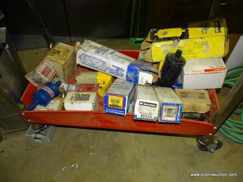 METAL UTILITY CART AND CONTENTS. INCLUDES: FILTERS, PARTS, A THREE PHASE VOLTAGE METER, ETC.CART
