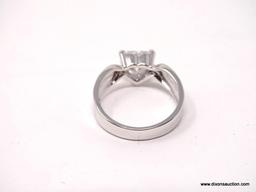 .925 STERLING SILVER RING WITH LARGE CENTER HEART SHAPED CZ STONE. COMES WITH BOX. RING SIZE IS