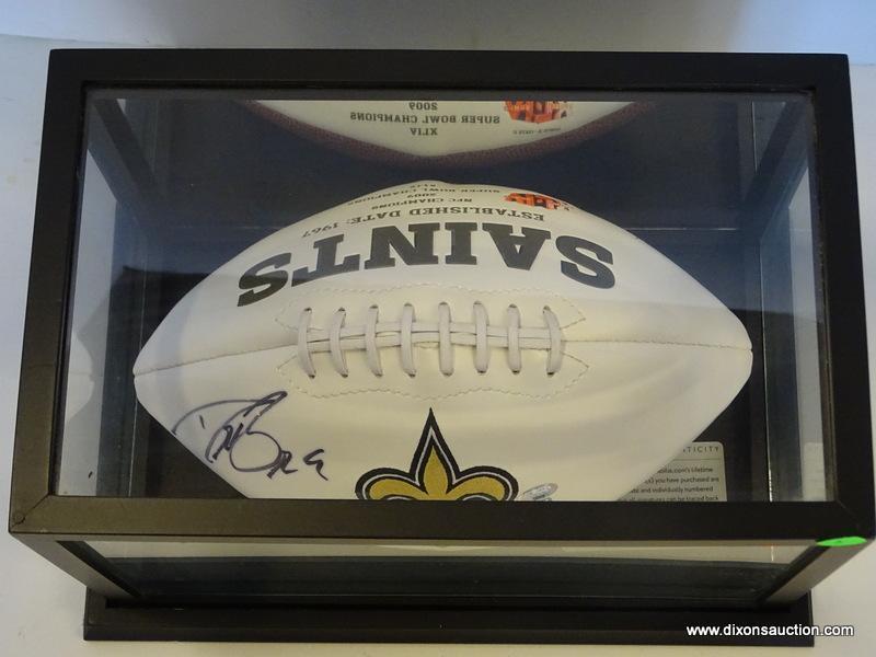 NEW ORLEANS SAINTS SIGNED FOOTBALL; SIGNED BY DREW BREES. HAS A BLACK AND GLASS PROTECTIVE CASING.