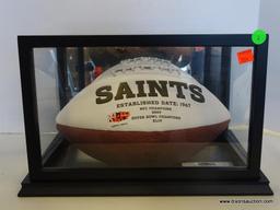 NEW ORLEANS SAINTS SIGNED FOOTBALL; SIGNED BY DREW BREES. HAS A BLACK AND GLASS PROTECTIVE CASING.