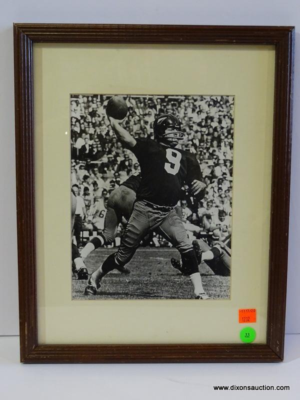 BLACK AND WHITE REDSKINS PHOTOGRAPH; IS OF SONNY JURGENSEN THROWING A FOOTBALL. IS IN A MAHOGANY