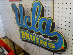 UCLA BRUINS SIGN; IS BLUE, BLACK, AND YELLOW IN COLOR AND MEASURES 22 IN X 18 IN