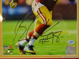 SIGNED REDSKINS PHOTOGRAPH; PHOTO IS OF AND IS SIGNED BY BRIAN ORAKPO. IS AN 8 IN X 10 IN PHOTOGRAPH