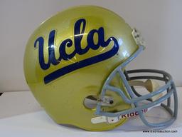 TROPHY HELMET; UCLA TROPHY FOOTBALL HELMET IN METALLIC GOLD. NOT TO BE USED IN ACTIVE PLAY.