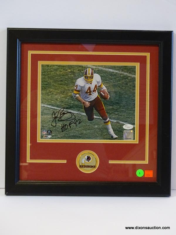 SIGNED REDSKINS PHOTOGRAPH; PHOTO IS OF AND IS SIGNED BY JOHN RIGGINS. IS AN 8 IN X 10 IN PHOTOGRAPH