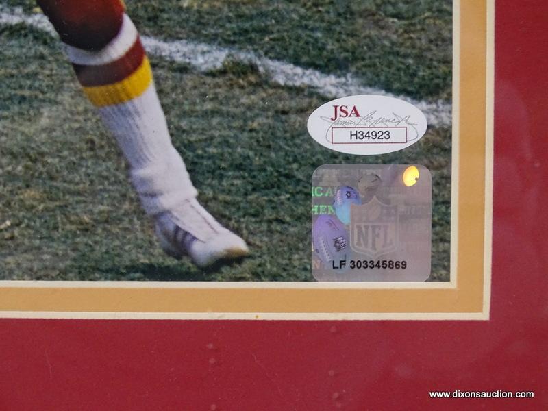 SIGNED REDSKINS PHOTOGRAPH; PHOTO IS OF AND IS SIGNED BY JOHN RIGGINS. IS AN 8 IN X 10 IN PHOTOGRAPH