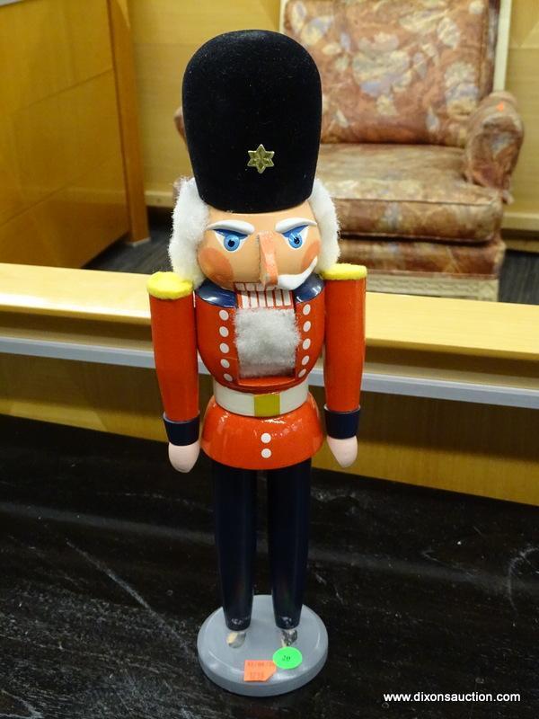 NUTCRACKER; NUTCRACKER OF A SOLDIER WITH RED UNIFORM AND TALL BLACK HAT. HAS SEEN SOME WEAR