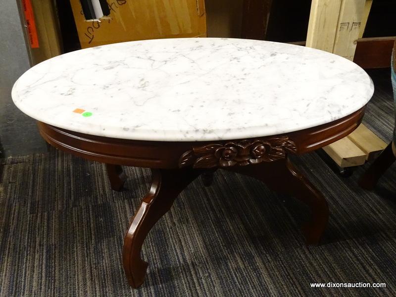 VICTORIAN MARBLE TOP COFFEE TABLE; HAS A WHITE MARBLE TOP AND MAHOGANY BONES WITH FLORAL CARVED