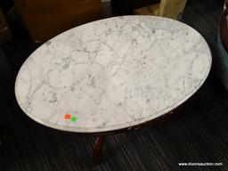 VICTORIAN MARBLE TOP COFFEE TABLE; HAS A WHITE MARBLE TOP AND MAHOGANY BONES WITH FLORAL CARVED