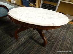 VICTORIAN MARBLE TOP COFFEE TABLE; HAS A WHITE MARBLE TOP AND MAHOGANY BONES WITH FLORAL CARVED