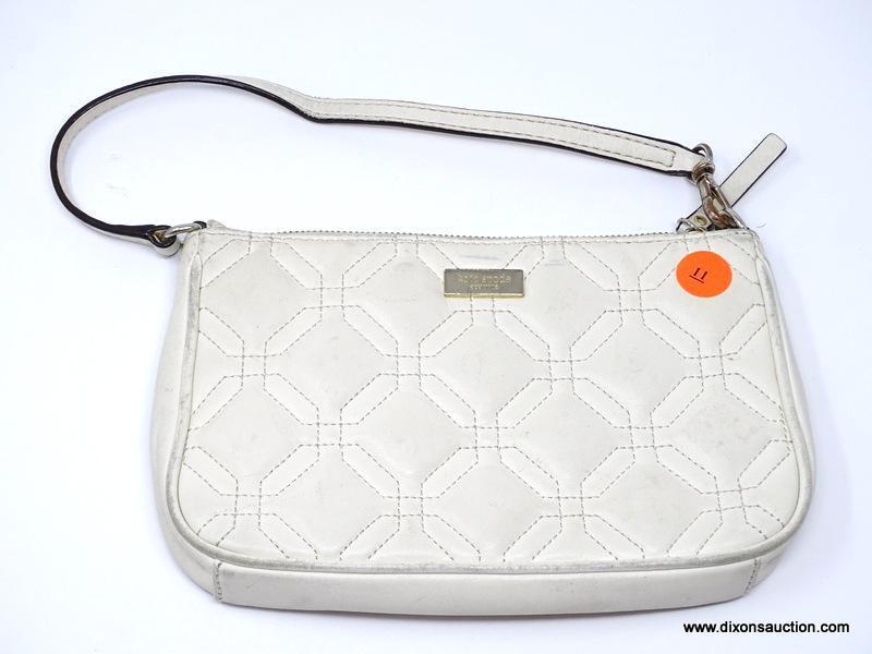 KATE SPADE CREAM COLORED QUILTED LEATHER CLUTCH. MEASURE APPROX. 8" X 5". SHOWS SIGNS OF WEAR.