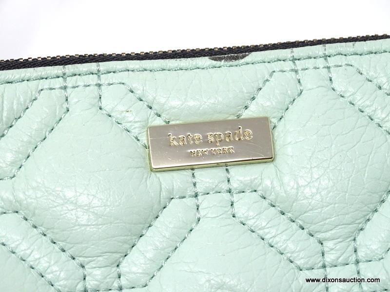 KATE SPADE MINT GREEN COLORED QUILTED LEATHER CLUTCH. MEASURES APPROX. 8" X 5". SHOWS SIGNS OF WEAR.