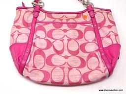 COACH PINK LOGO HOBO BAG WITH STUD DETAILING. MEASURES 15" X 11". SHOWS SIGNS OF WEAR.
