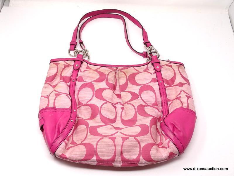 COACH PINK LOGO HOBO BAG WITH STUD DETAILING. MEASURES 15" X 11". SHOWS SIGNS OF WEAR.