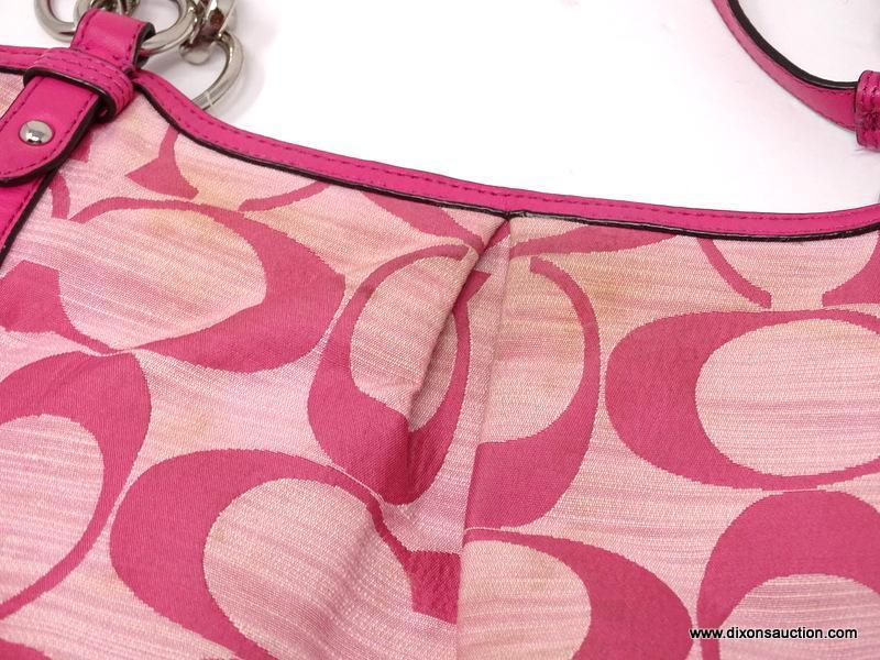 COACH PINK LOGO HOBO BAG WITH STUD DETAILING. MEASURES 15" X 11". SHOWS SIGNS OF WEAR.