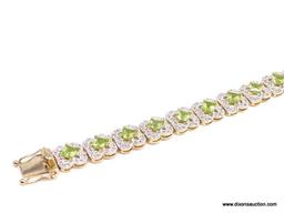 .925 SILVER PERIDOT & WHITE TOPAZ BRACELET WITH YELLOW GOLD OVERLAY. 19 SQUARE PERIDOT APPROX.