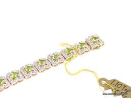 .925 SILVER PERIDOT & WHITE TOPAZ BRACELET WITH YELLOW GOLD OVERLAY. 19 SQUARE PERIDOT APPROX.