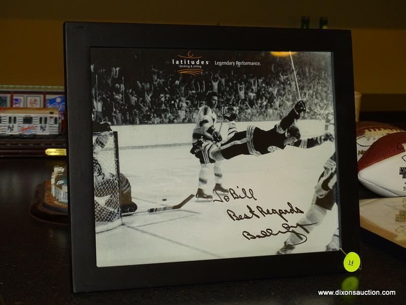 (BAS) FRAMED AND AUTOGRAPHED PHOTO OF BOBBY ORR FROM LATITUDES DECK & RAILING. IS IN A BLACK FRAME