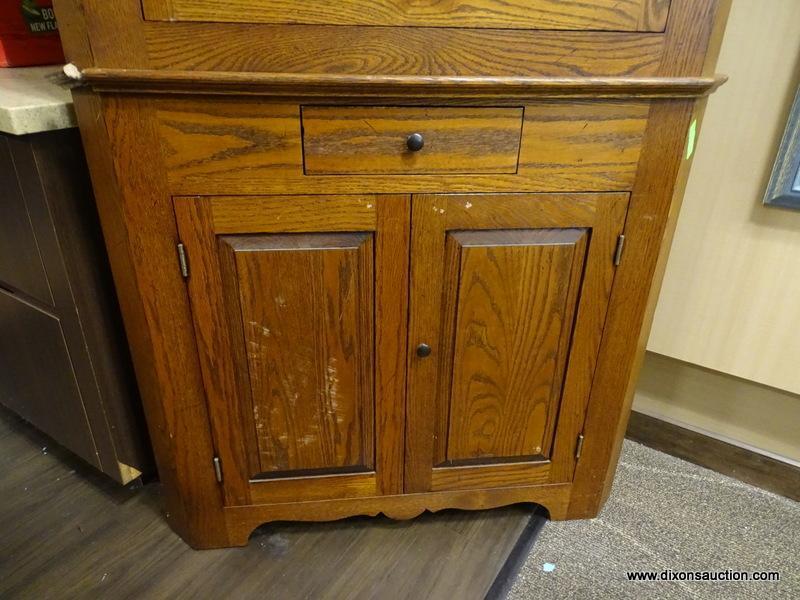 VINTAGE 2 PIECE OAK CORNER CABINET WITH CROWN MOLDING, 9 PANELED AREAS ON THE DOOR (7 HAVE GLASS