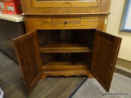 VINTAGE 2 PIECE OAK CORNER CABINET WITH CROWN MOLDING, 9 PANELED AREAS ON THE DOOR (7 HAVE GLASS