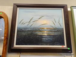 FRAMED OIL ON CANVAS OF A BEACH SUNSET WITH THE TIDES ROLLING AGAINST THE BEACH. IS IN A MAHOGANY