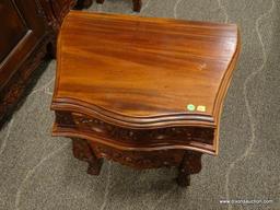 SOLID MAHOGANY HIGHLY CARVED 3 DRAWER NIGHTSTAND. IS 1 OF A PAIR. MEASURES 24 IN X 17 IN X 27 IN.