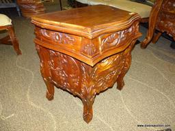 SOLID MAHOGANY HIGHLY CARVED 3 DRAWER NIGHTSTAND. IS 1 OF A PAIR. MEASURES 24 IN X 17 IN X 27 IN.