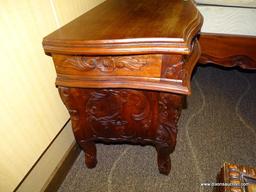 SOLID MAHOGANY HIGHLY CARVED 3 DRAWER NIGHTSTAND. IS 1 OF A PAIR. MEASURES 24 IN X 17 IN X 27 IN.