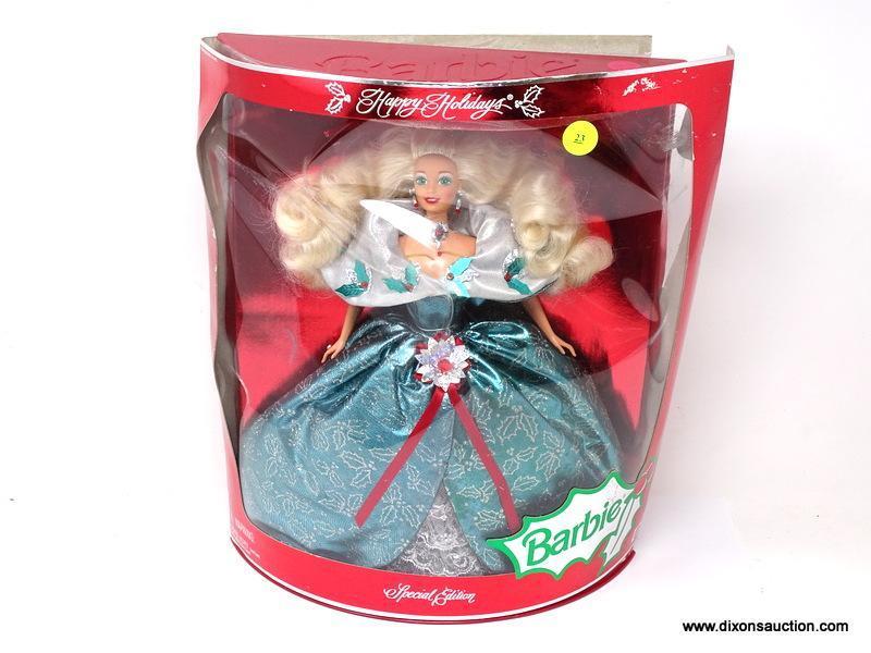 SPECIAL EDITION HAPPY HOLIDAYS BARBIE IN PACKAGE. IS IN A BLUE AND SILVER HOLLY THEMED DRESS AND IN